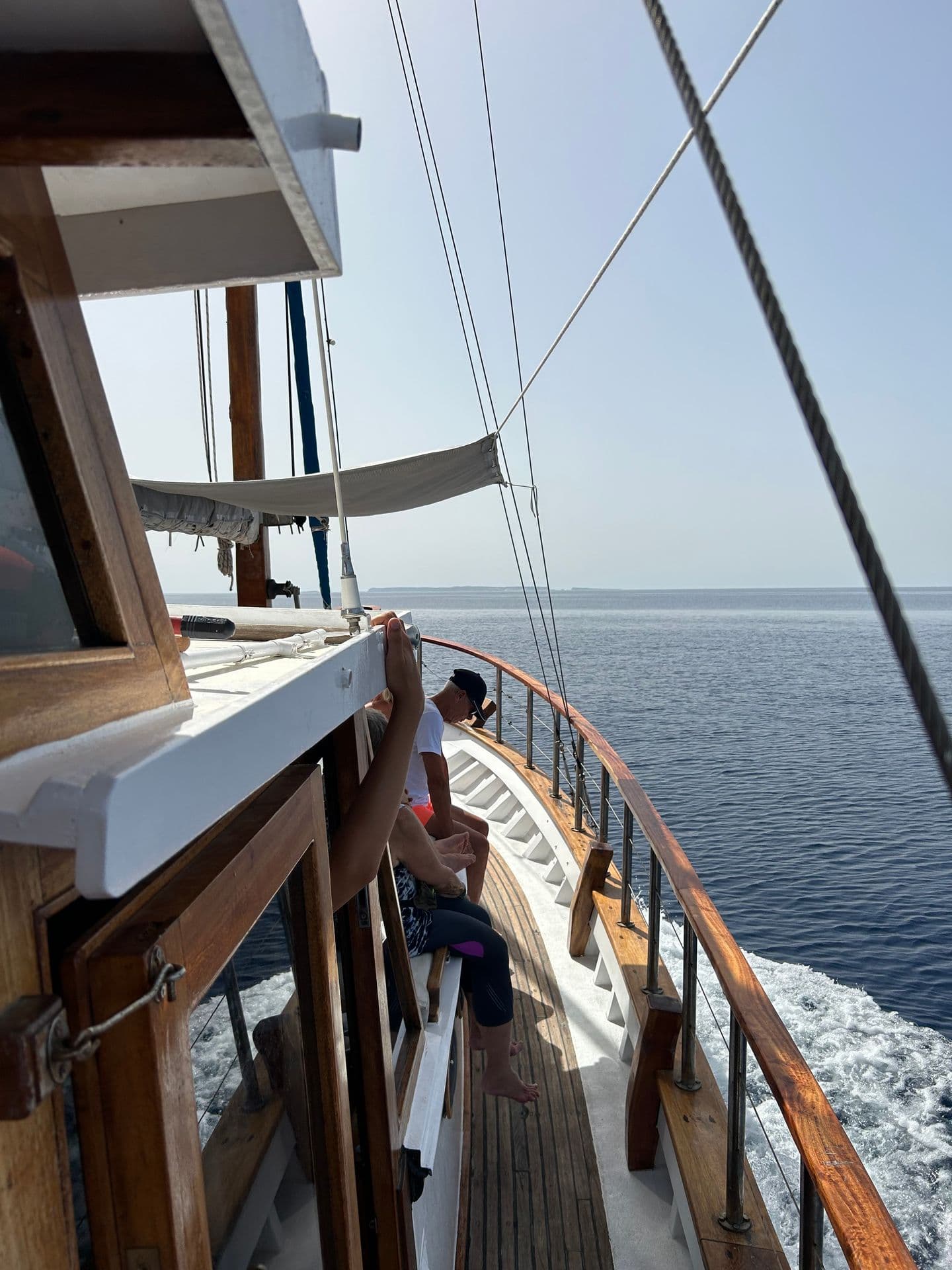 Traditional wooden boat sailing off southeast Crete